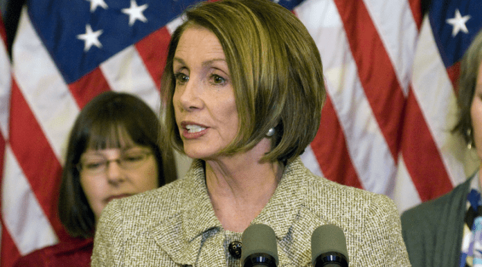 Nancy Pelosi at the podium.
