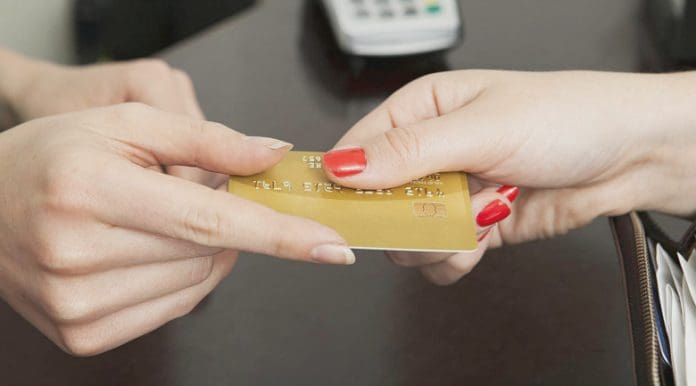 cash-money-invoices Handing over card representing getting paid.