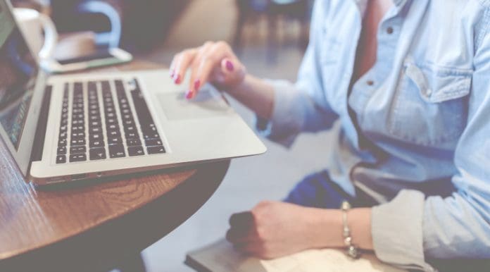 pink tax crm woman typing working laptop