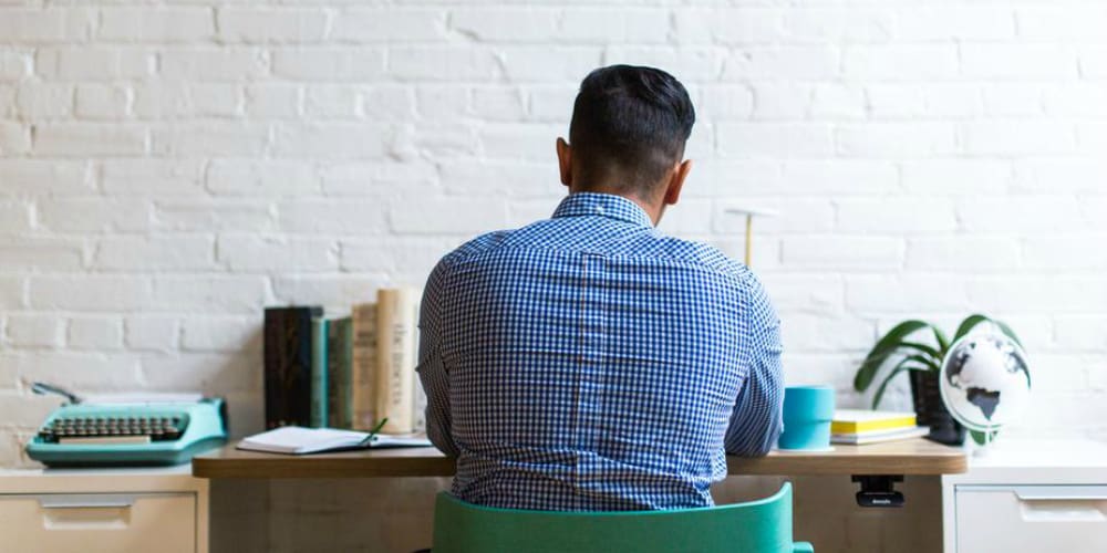 career-listing-jargon-man-desk startup optimize to key metric