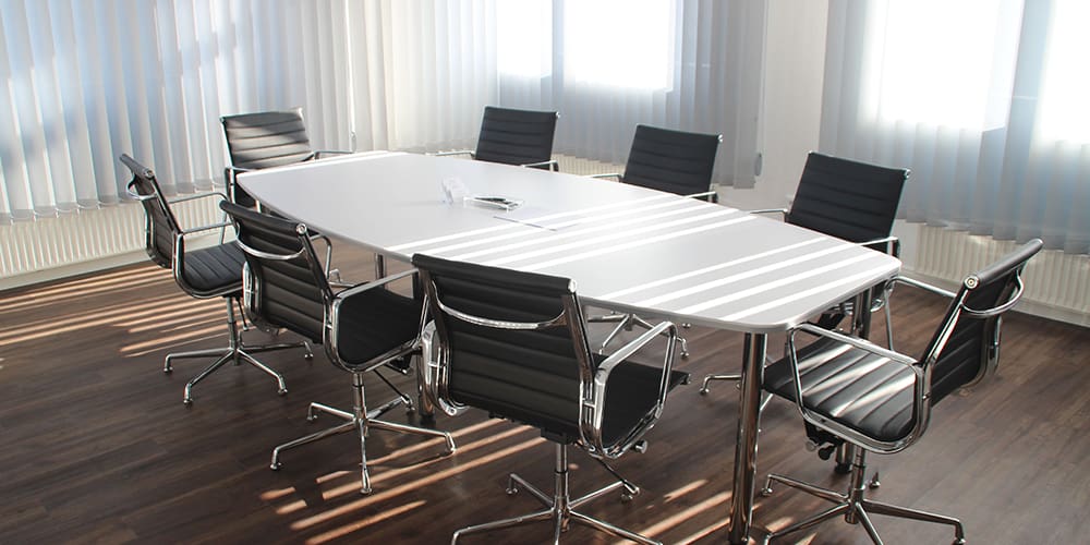 An empty meeting room, unfilled by work from home employees.