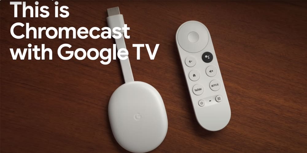 Chromecast with Google TV on a wooden background.