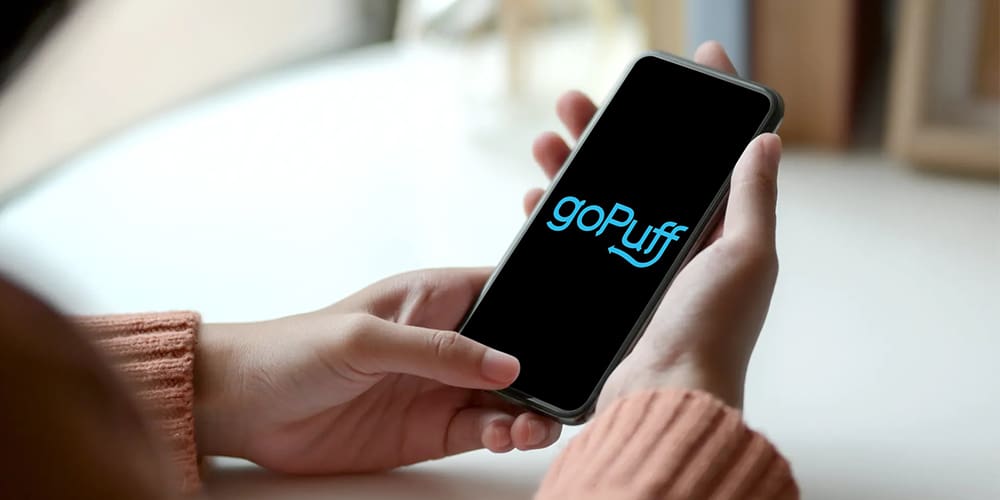 goPuff app open on iPhone in woman's hands.