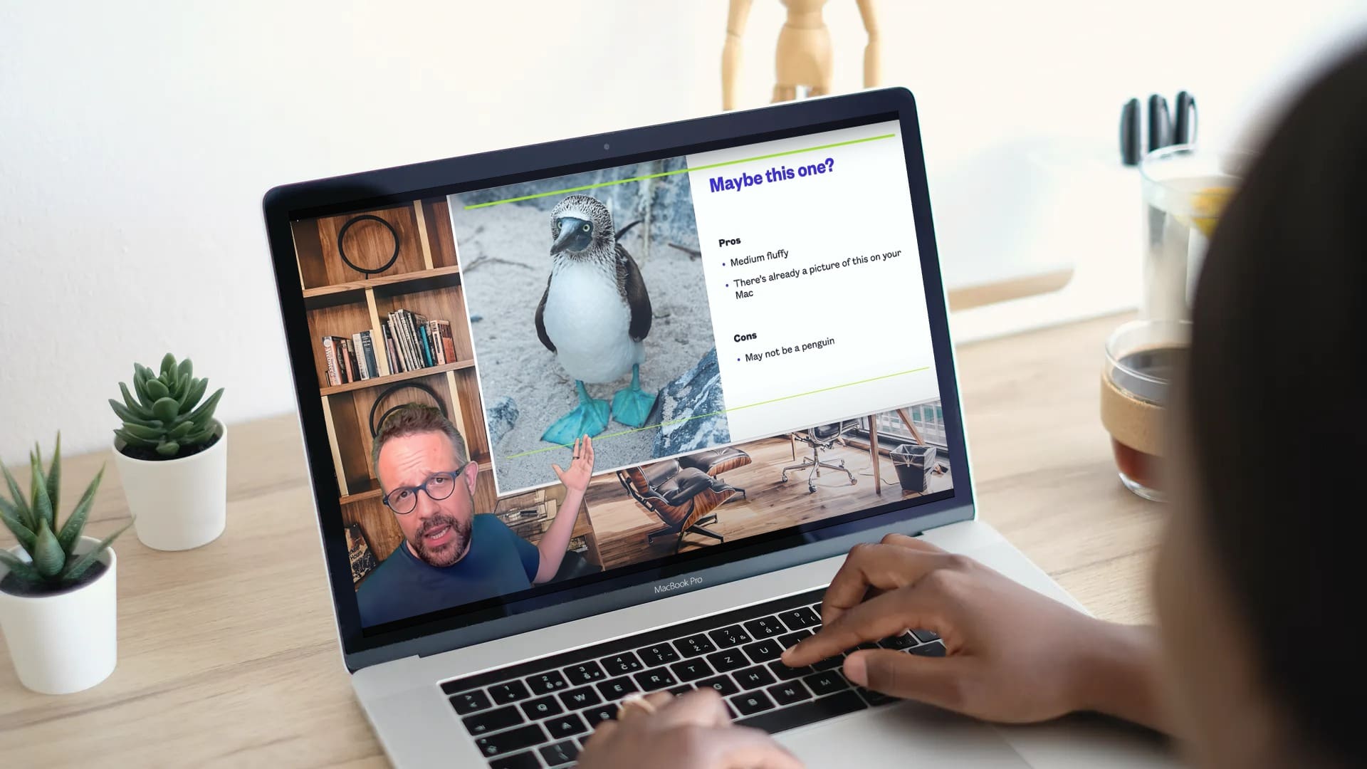 Woman watches demo video of one of mmhmm's creative video presentations.