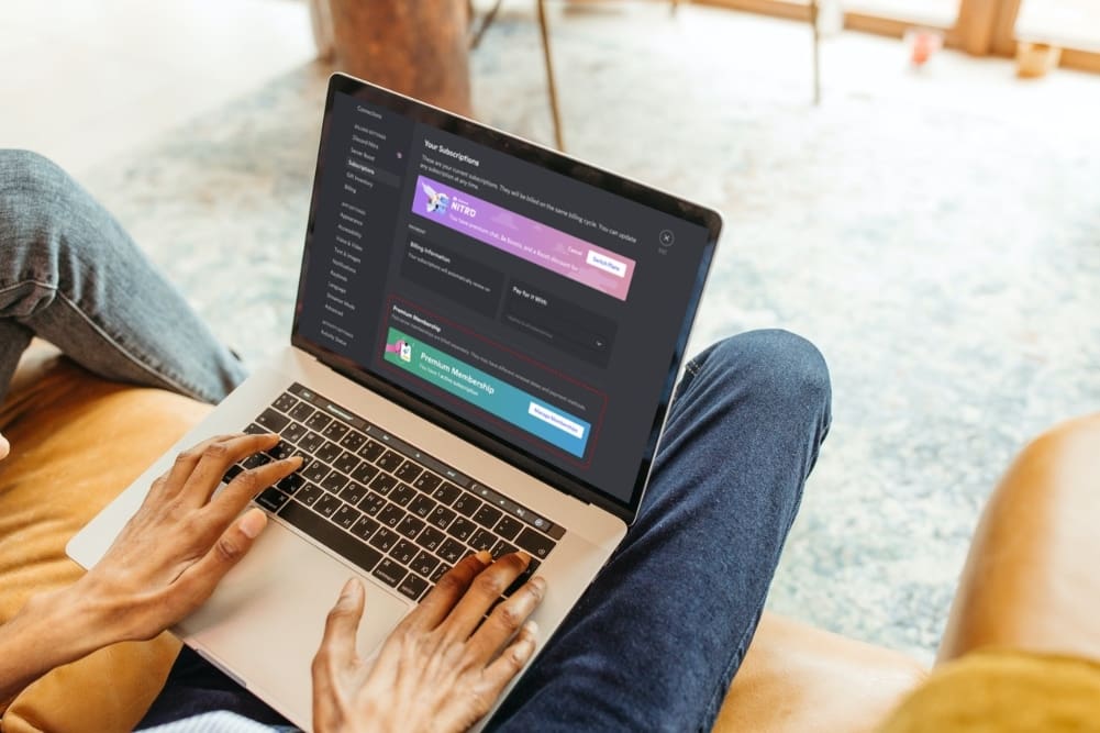 Man using laptop to view Discord Premium Memberships.