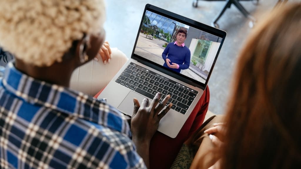person watching ai actor on laptop person watching ai actor on laptop