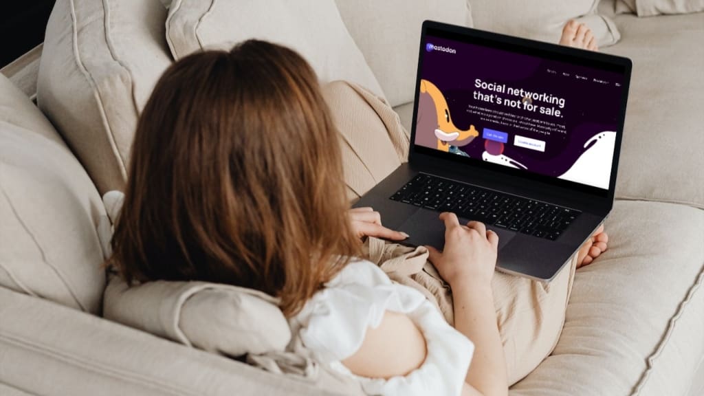 Person looking at Mastadon, Twitter competitor in Germany, on laptop Person looking at Mastadon, Twitter competitor in Germany, on laptop