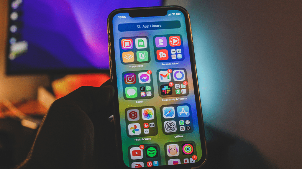 An iPhone in a dimly lit room open to an app screen with apps that have experienced sherlocking before.