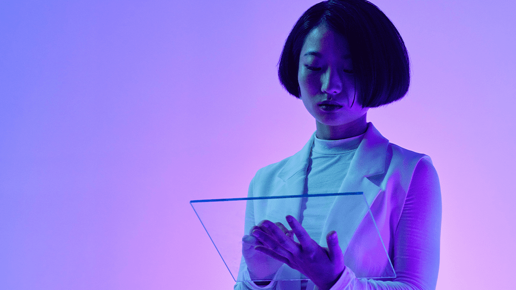 A woman with short hair stands in a purple and blue background tapping on an artificial intelligence tablet made of smart glass.