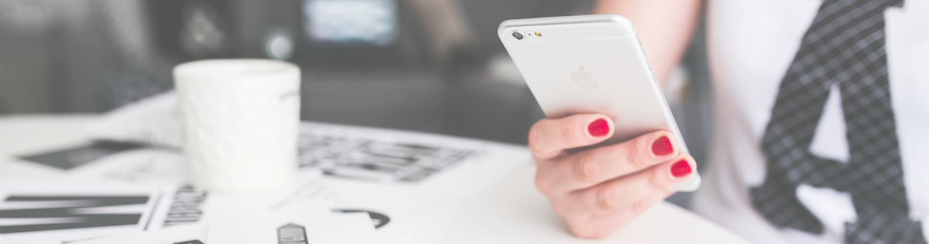 Person holding phone representing customer service.