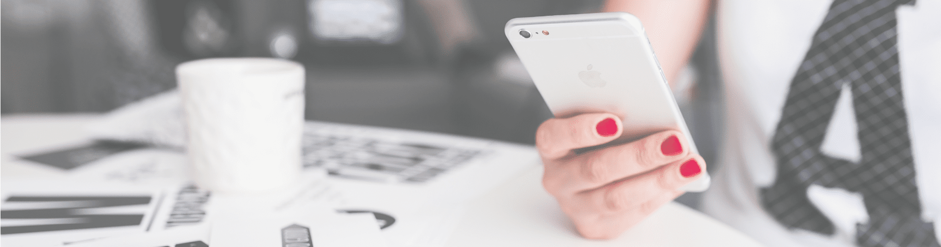 Person holding phone challenging the myth of an ideal worker