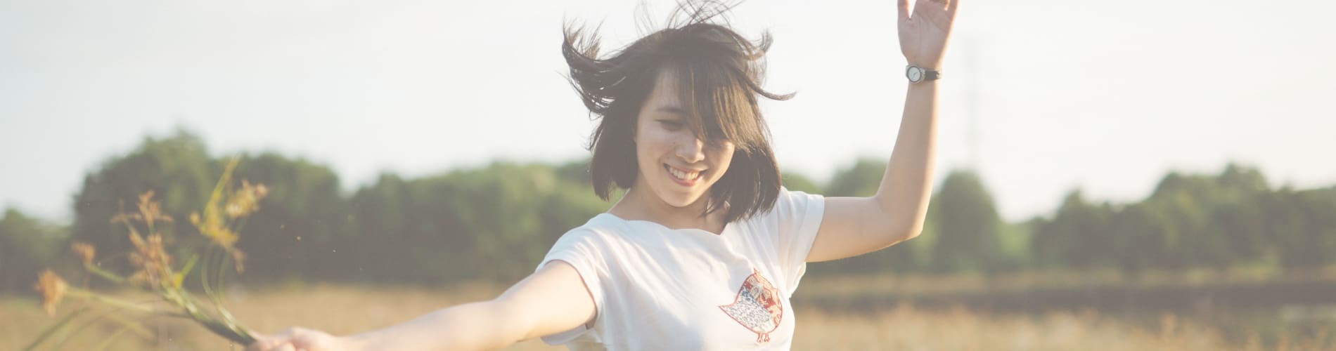 Girl laughing and smiling while being happy.