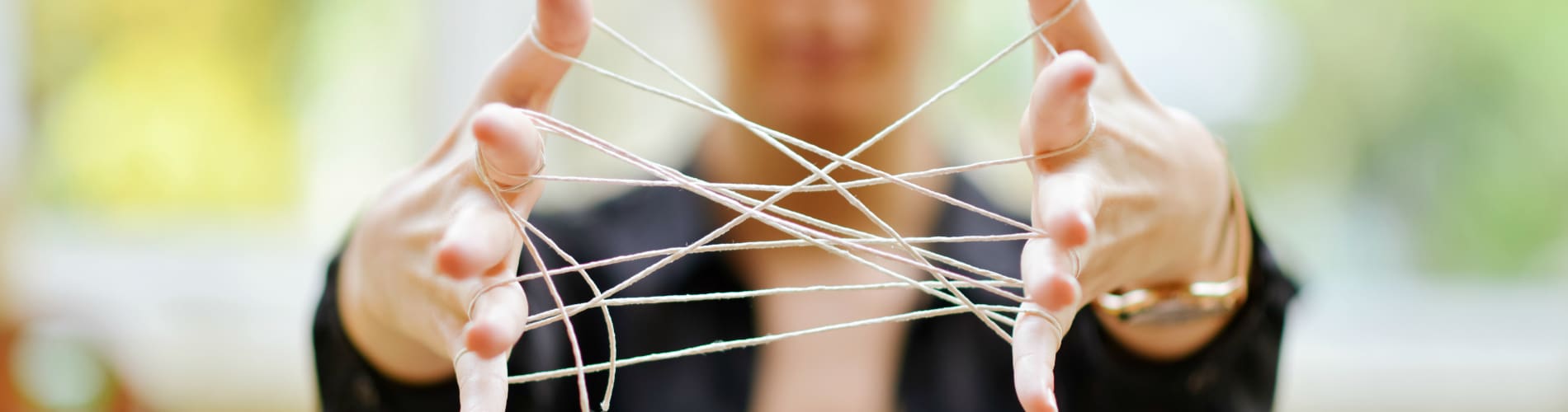 Woman holding strings represent mental models.