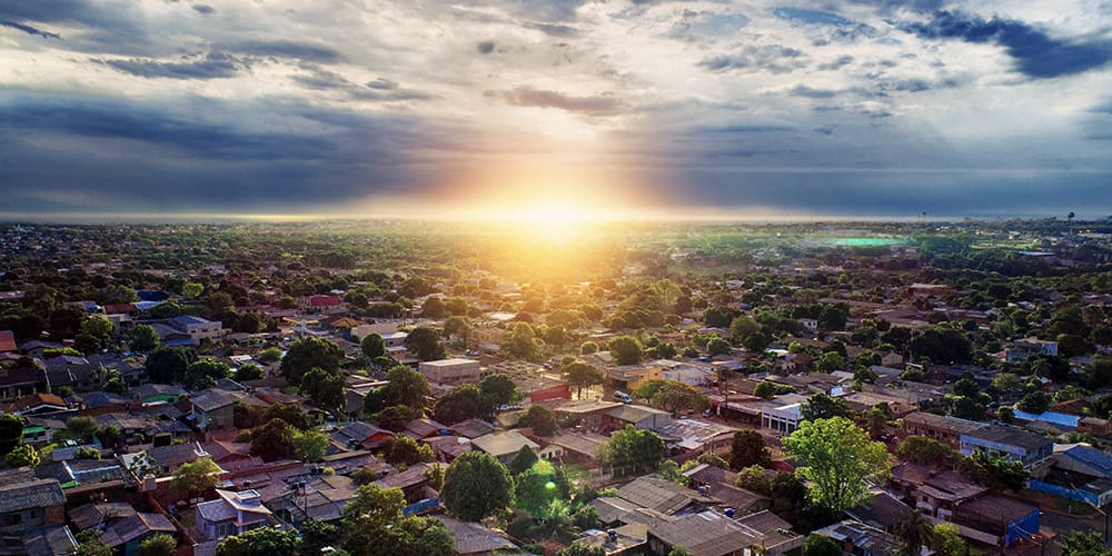 Sunrise over affordable housing REIT neighborhood