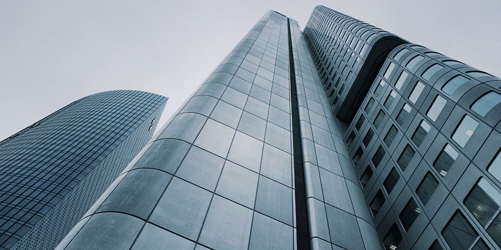 Looking up at a building in a city environment.