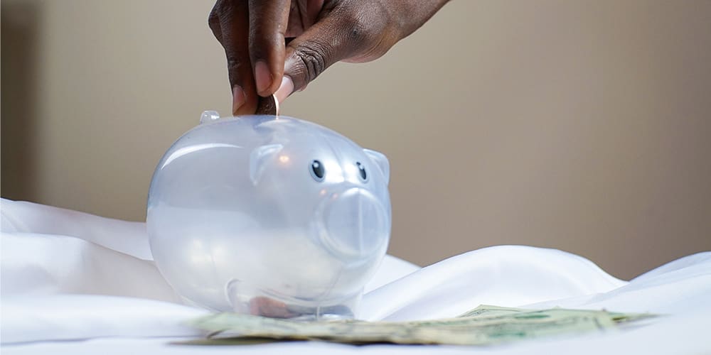 Plastic clear piggy bank representing savings.