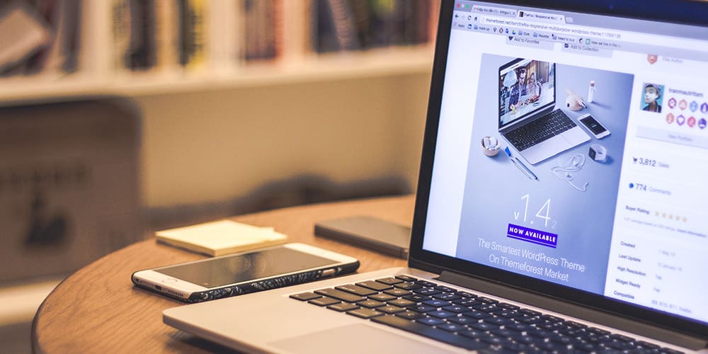 Website's marketing and growth on a laptop open to website in progress.