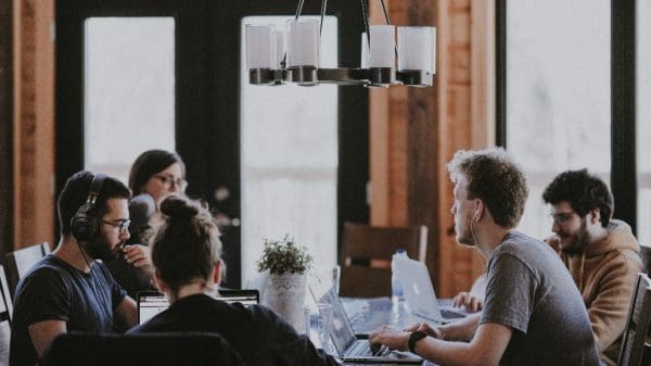 employees discussing delegation in a meeting