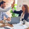 Two people high-fiving, representing chemistry in mentorship