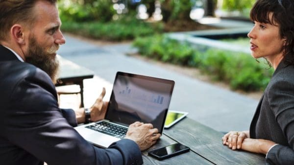 Woman and man meeting discussing their role asleader.