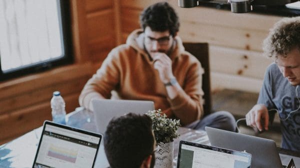 people at work talking about customer feedback