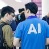 person wearing blue ai shirt