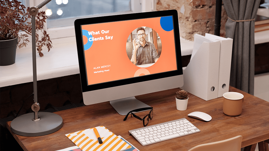 A mac computer open to an advertising page showing client testimony page for a orange-themed company.