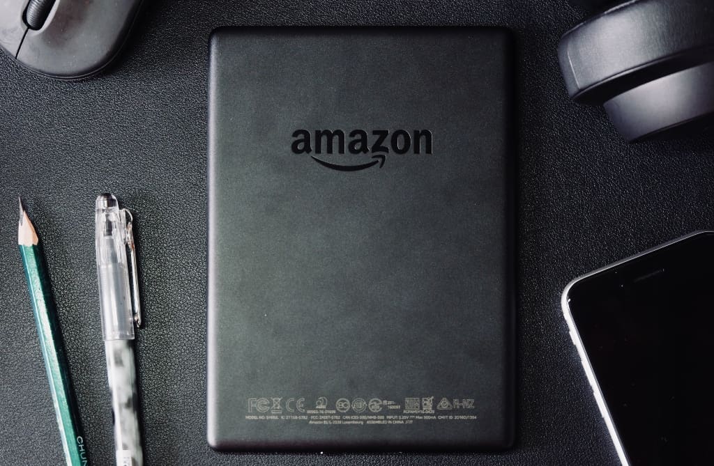 Mouse, headphones, phone, pen, pencil, and Amazon tablet